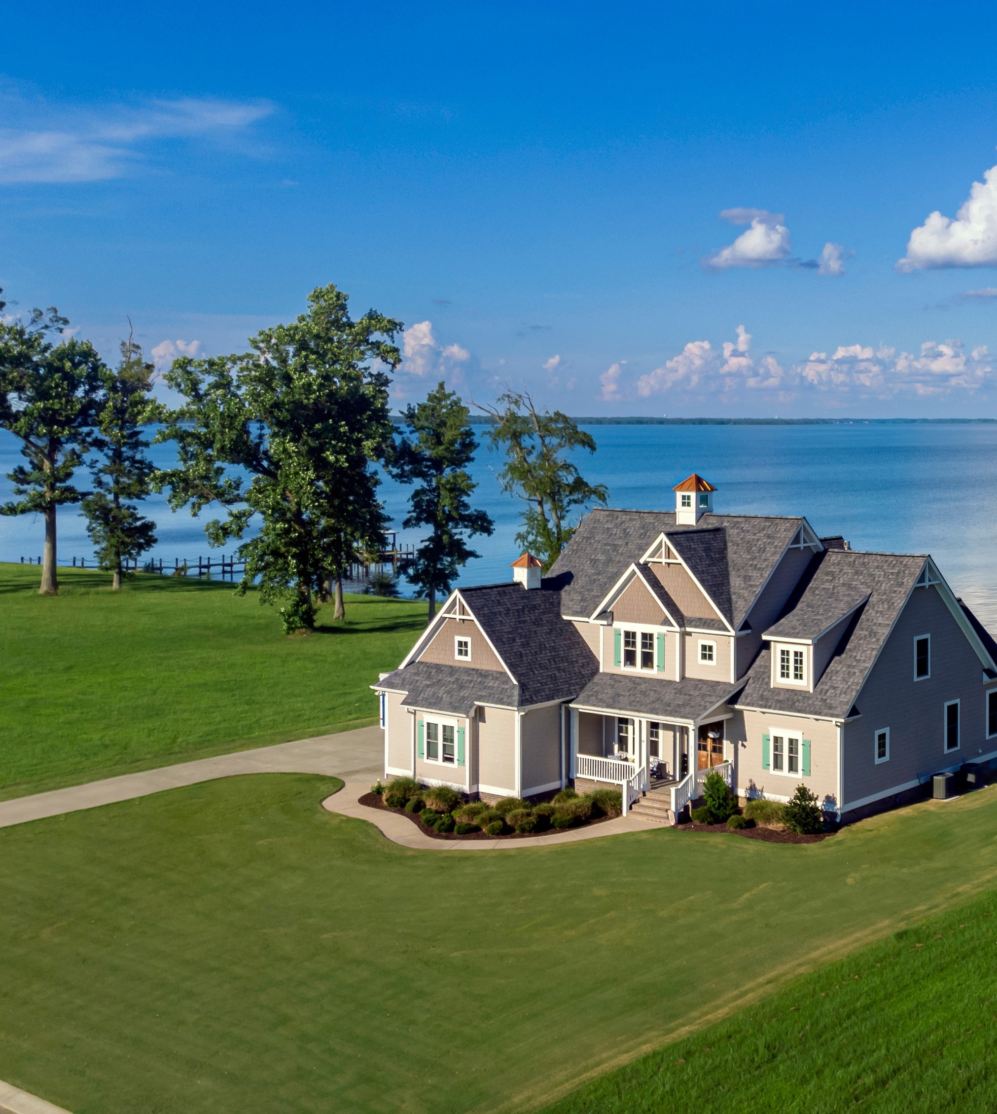 Exterior overview shot of a beautiful house on the shoreline