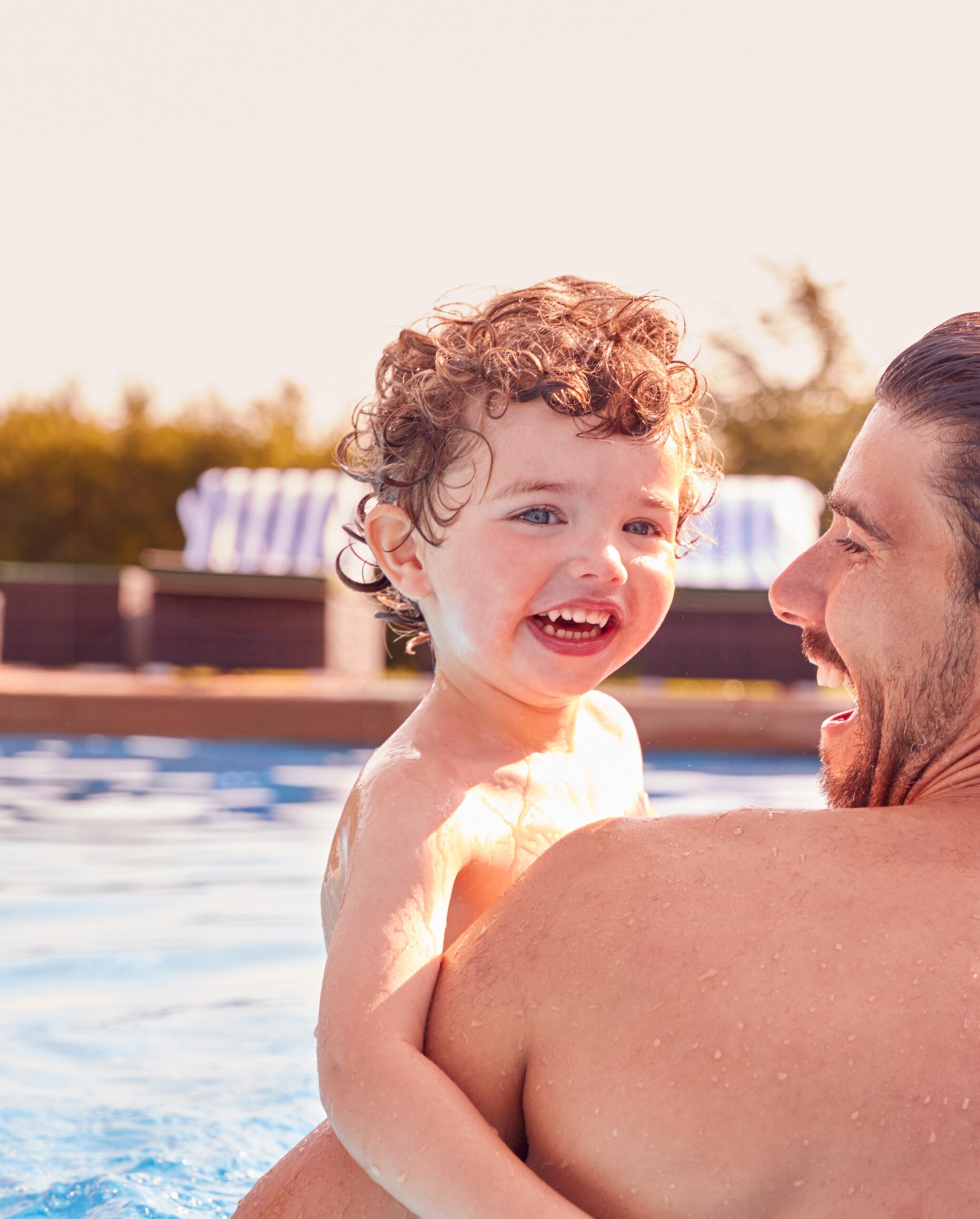Father and son enjoying the pool