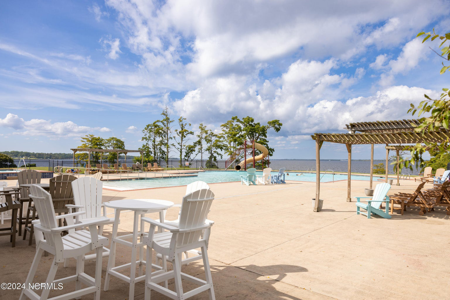 Pool with a cabana and slide