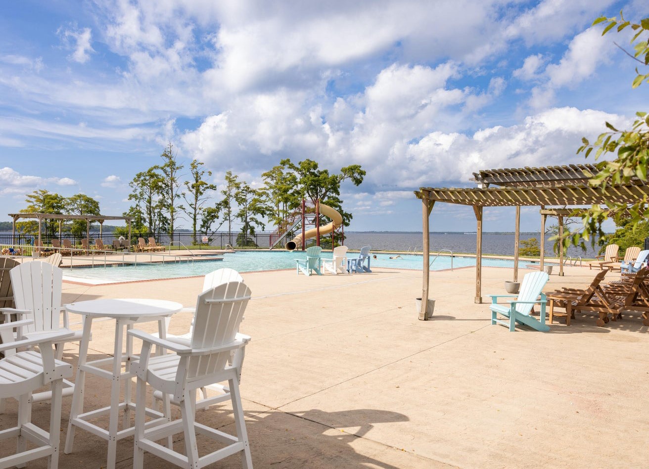 Pool with a cabana and slide